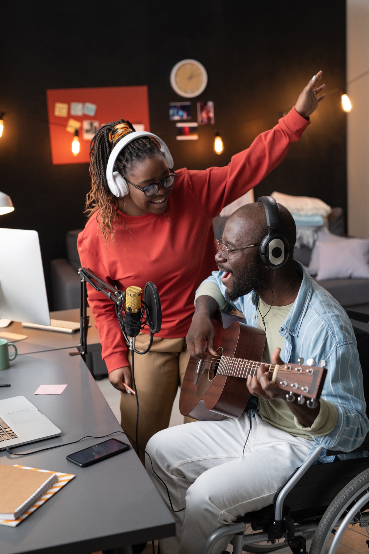 Two musicians recording a song together